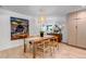 Elegant dining room with a wooden table, decorative pendant lighting, and modern décor at 4930 Gray St, Denver, CO 80212