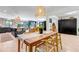 Open dining room with kitchen and living room in the background at 4930 Gray St, Denver, CO 80212