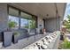 Inviting front porch with stylish seating, decorative stone, and a view of the neighborhood at 4930 Gray St, Denver, CO 80212