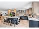 Stylish kitchen boasts a spacious island, sleek cabinetry, stainless steel appliances, and hardwood floors at 4930 Gray St, Denver, CO 80212