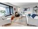 Bright living room with comfortable seating, modern decor, and large windows that provide natural light at 4930 Gray St, Denver, CO 80212