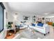 Bright living room featuring hardwood floors, modern decor, and an open layout at 4930 Gray St, Denver, CO 80212