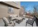 Back patio with cozy seating arrangements, perfect for enjoying outdoor living and relaxation at 7262 Serena Dr, Castle Pines, CO 80108