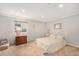 Basement bedroom with neutral walls, carpet, window, and a dresser, creating a tranquil retreat at 7262 Serena Dr, Castle Pines, CO 80108