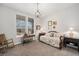 Cozy bedroom with neutral walls and a large window for natural light at 7262 Serena Dr, Castle Pines, CO 80108