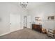 This bedroom has a large closet, neutral walls, and a classic light fixture at 7262 Serena Dr, Castle Pines, CO 80108