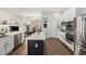 Modern kitchen with marble countertops, stainless steel appliances, and an island is the perfect cooking space at 7262 Serena Dr, Castle Pines, CO 80108