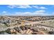 Aerial view shows the home's location in a peaceful neighborhood near roads and businesses at 23951 E Easter Pl, Aurora, CO 80016