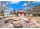 Charming home with stone accents, red doors, and a beautiful water feature in the front walkway at 23951 E Easter Pl, Aurora, CO 80016