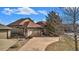 Beautiful exterior view of home featuring a wide driveway and attached two-car garage at 23951 E Easter Pl, Aurora, CO 80016