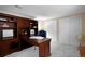 This office offers a built-in desk, storage, carpet, and a view of the double door closet at 23951 E Easter Pl, Aurora, CO 80016
