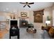 A cozy living room featuring a fireplace, plush seating, and elegant decor at 23951 E Easter Pl, Aurora, CO 80016