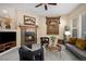 Inviting living room with fireplace, plush seating, and decorative tapestry art at 23951 E Easter Pl, Aurora, CO 80016