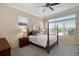Cozy bedroom with a four-poster bed, neutral decor, and plenty of natural light at 23951 E Easter Pl, Aurora, CO 80016