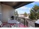 Outdoor patio with metal table and chairs and a lovely neighborhood view at 23951 E Easter Pl, Aurora, CO 80016