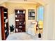 Bright reading nook featuring bookshelves, comfortable seating, and natural light at 23951 E Easter Pl, Aurora, CO 80016