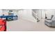 Finished basement featuring neutral carpeting, a staircase, and ample space for recreation or relaxation at 5061 S Florence Dr, Englewood, CO 80111