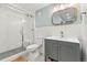 Updated bathroom features a glass-enclosed shower, modern vanity, and stylish fixtures at 5061 S Florence Dr, Englewood, CO 80111