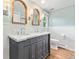 Bathroom with marble countertops and stylish mirrors at 5061 S Florence Dr, Englewood, CO 80111
