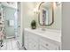 Clean bathroom with a white vanity and floral shower curtain at 5061 S Florence Dr, Englewood, CO 80111