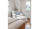 Bedroom with a white armchair and ottoman for relaxing at 5061 S Florence Dr, Englewood, CO 80111