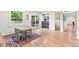 Dining area with hardwood floors, a view to the patio, and a nearby laundry room at 5061 S Florence Dr, Englewood, CO 80111
