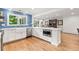 Open kitchen featuring blue subway tile, an island, and stainless steel appliances at 5061 S Florence Dr, Englewood, CO 80111