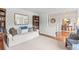 Inviting living room featuring a cozy sofa, stylish decor, and a view into adjacent rooms at 5061 S Florence Dr, Englewood, CO 80111