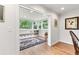 Sunroom with hardwood floors, custom built-in bench seating, and abundant natural light at 5061 S Florence Dr, Englewood, CO 80111