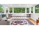 Bright sunroom featuring built-in bench with storage and large windows at 5061 S Florence Dr, Englewood, CO 80111