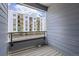 Private balcony offering stunning view of the building complex in the distance at 348 N. Geneva St, Aurora, CO 80010