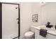 Modern bathroom featuring a glass-enclosed shower, sleek vanity, and contemporary fixtures, creating a spa-like ambiance at 348 N. Geneva St, Aurora, CO 80010