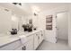 Elegant bathroom with double vanity, quartz counters, and matte black fixtures at 348 N. Geneva St, Aurora, CO 80010