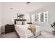 Bright bedroom with a comfortable bed, modern decor, and natural light from the window at 348 N. Geneva St, Aurora, CO 80010