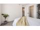 Minimalist bedroom featuring bright white walls, and a cozy bed at 348 N. Geneva St, Aurora, CO 80010
