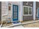 Close-up of a townhome entrance with a blue door and modern address plaque at 348 N. Geneva St, Aurora, CO 80010