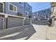 Modern townhomes featuring private garages and contemporary exterior design at 348 N. Geneva St, Aurora, CO 80010