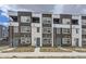 Modern townhome complex with brick accents, balconies, and well-maintained landscaping at 348 N. Geneva St, Aurora, CO 80010