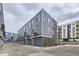 Row of garage doors with gray siding showcasing modern architectural design at 348 N. Geneva St, Aurora, CO 80010