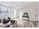Inviting living room featuring modern furniture and wood-look floors at 348 N. Geneva St, Aurora, CO 80010