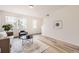 Bright living room featuring hardwood floors, recessed lighting, and ample natural light at 348 N. Geneva St, Aurora, CO 80010