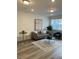 Open living room design with modern furniture and light wood floors at 348 N. Geneva St, Aurora, CO 80010