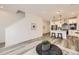 Open concept living space showcasing the kitchen and staircase with modern decor at 348 N. Geneva St, Aurora, CO 80010