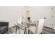 Bright office featuring a glass desk, neutral chair, and minimalist decor on wood floor at 348 N. Geneva St, Aurora, CO 80010