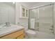 Well-lit bathroom with a tub-shower combo and vanity at 1629 N Clarkson St # 13, Denver, CO 80218