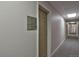Long hallway features neutral gray carpet, textured walls, and recessed lighting near apartment 13 at 1629 N Clarkson St # 13, Denver, CO 80218