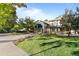 Beautiful clubhouse with well-manicured lawn and mature trees creates a welcoming community entrance at 8757 E Dry Creek Rd # 1512, Englewood, CO 80112
