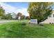 Well-manicured lawn surrounding the Saddle Ridge community sign, located near green trees at 8757 E Dry Creek Rd # 1512, Englewood, CO 80112
