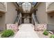 Exterior courtyard view showing entrances and well maintained brick, shrubs and architectural details at 8757 E Dry Creek Rd # 1512, Englewood, CO 80112