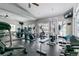 Community fitness center featuring cardio machines, weights, and a mirrored wall at 8757 E Dry Creek Rd # 1512, Englewood, CO 80112